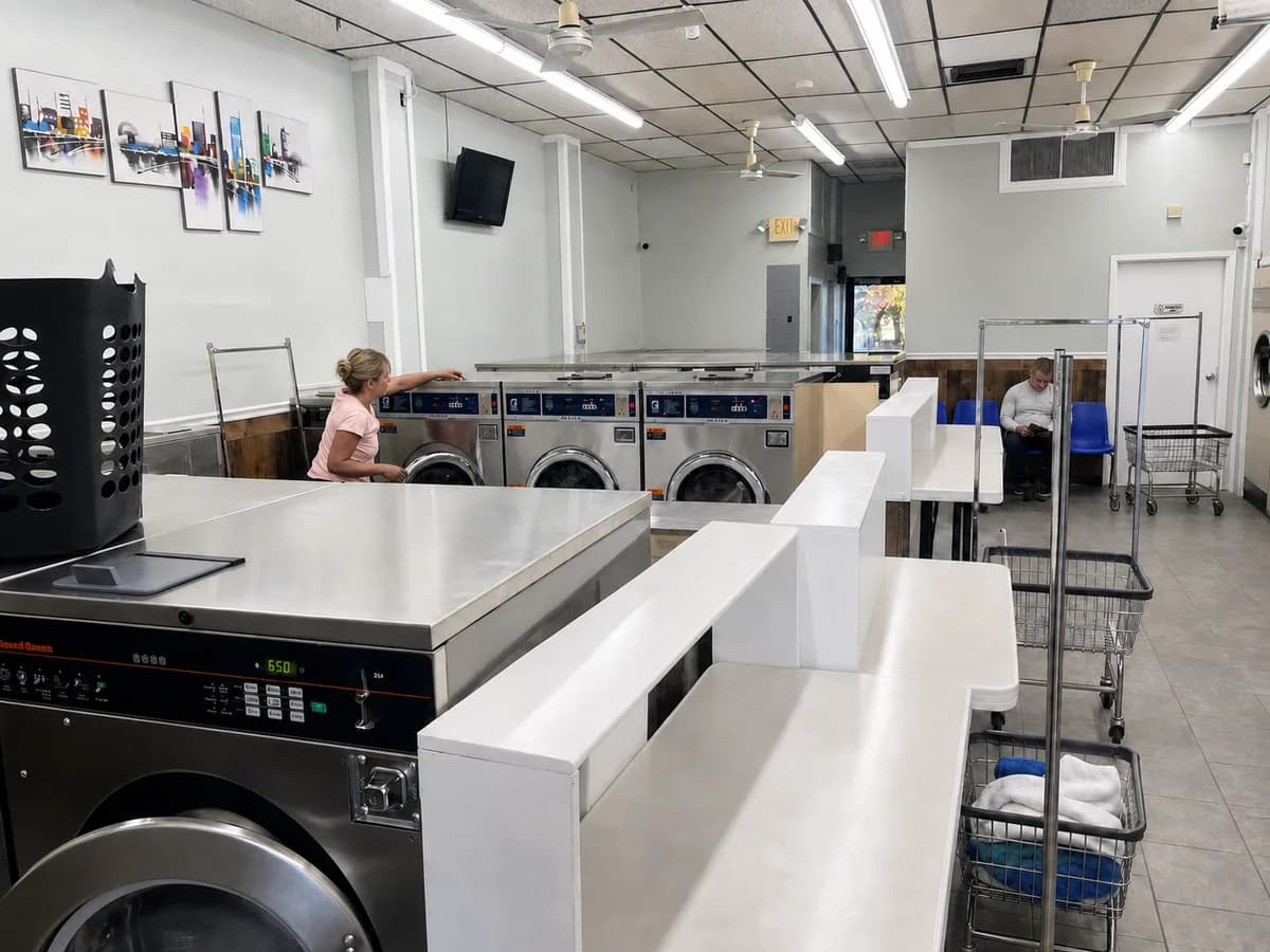 Folding stations and seating area inside the laundromat